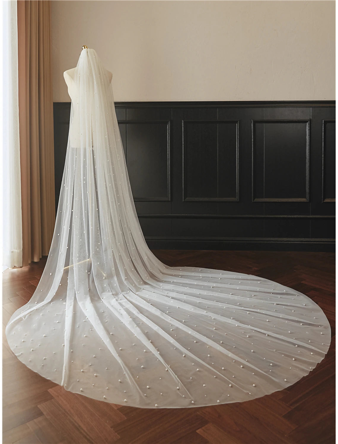Side profile of a bride with the elegant one-tier wedding veil.