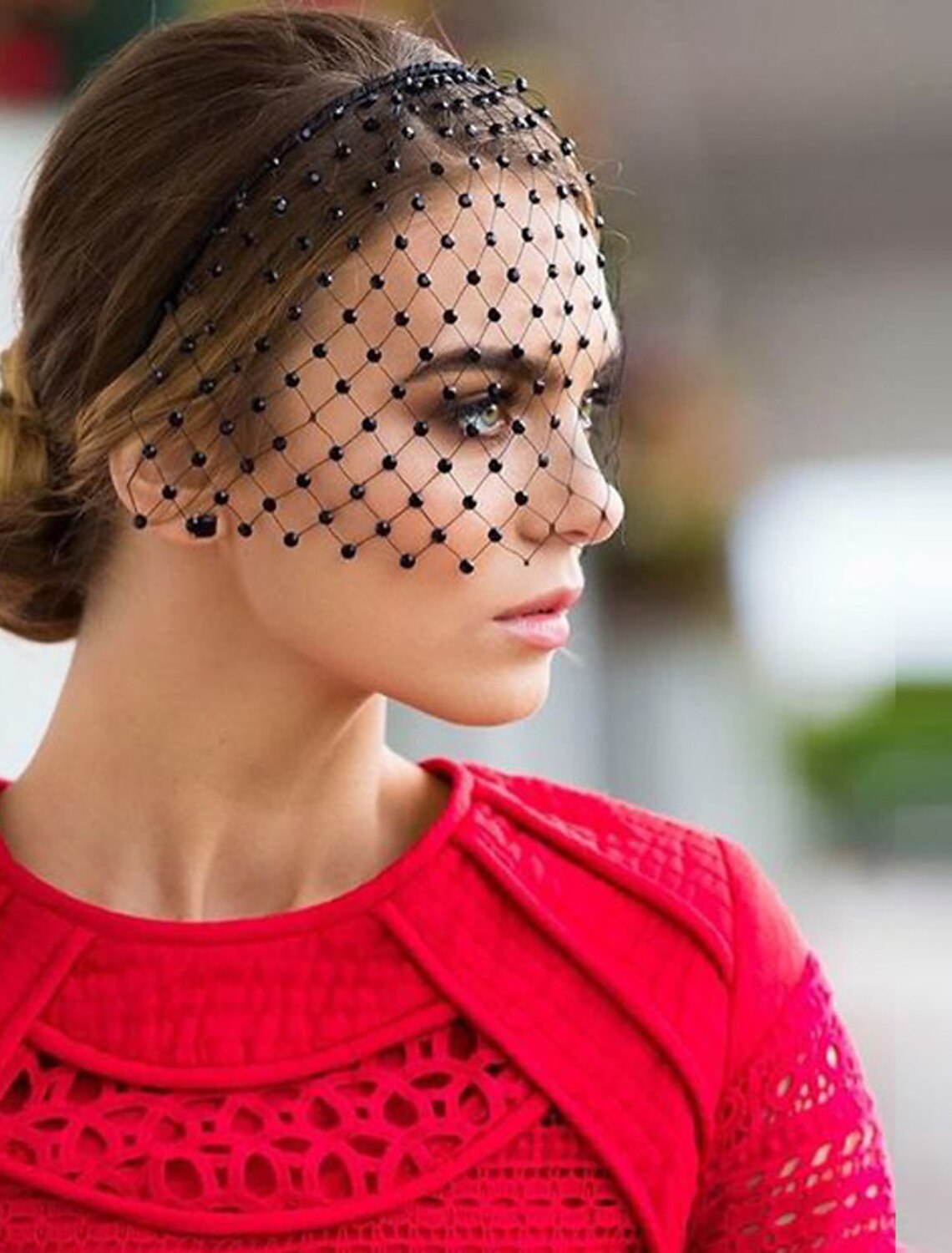 Side view of a bride showcasing the short blusher wedding veil.