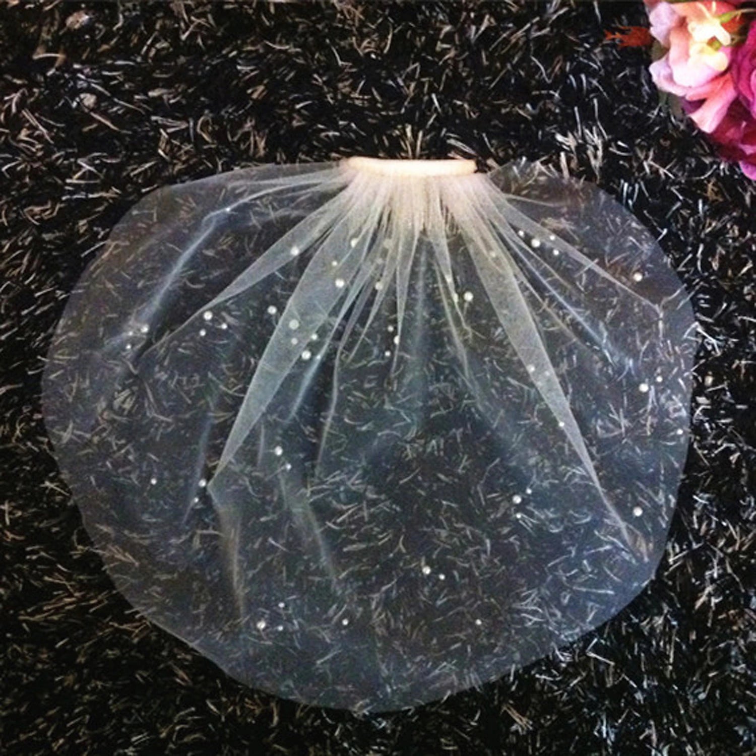Back view of a short wedding veil showing its elegant drape.