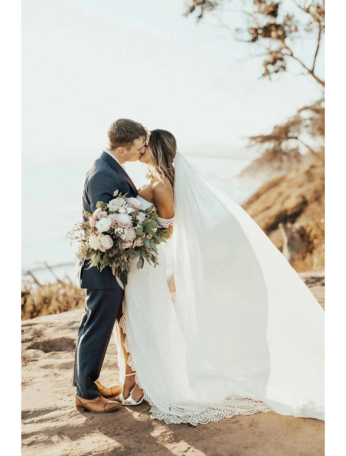 Bride posing with the elegant 280cm chiffon wedding veil.