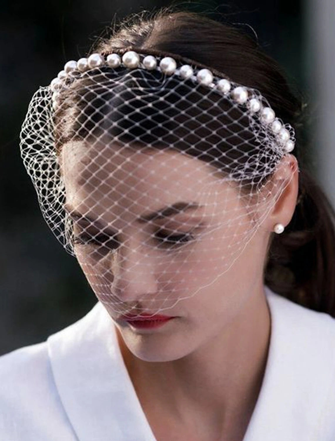 Close-up of the delicate solid tulle fabric of the one-tier wedding veil.