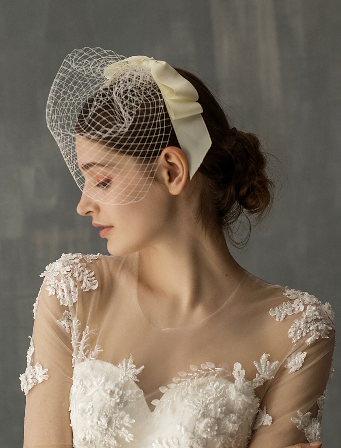Back view of the elegant tulle wedding veil showcasing its one-tier design.