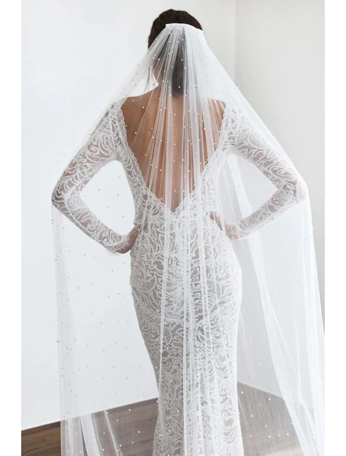 Elegant one-tier cathedral wedding veil with faux pearls.