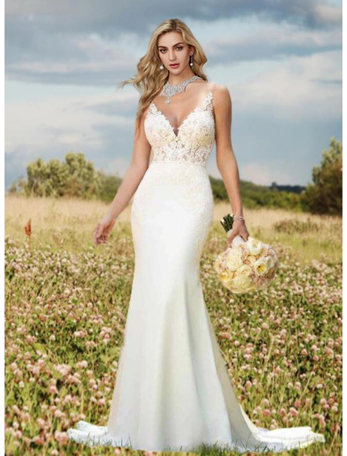 Back view of the mermaid bridal gown showcasing the open back and court train.