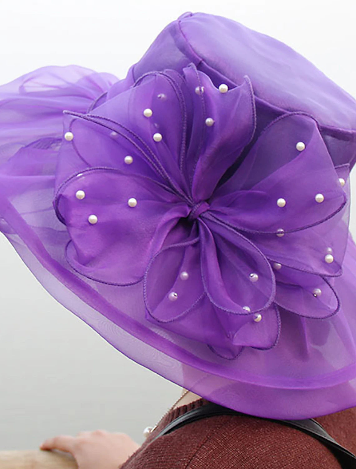 Vintage-style organza hat, perfect for special occasions.
