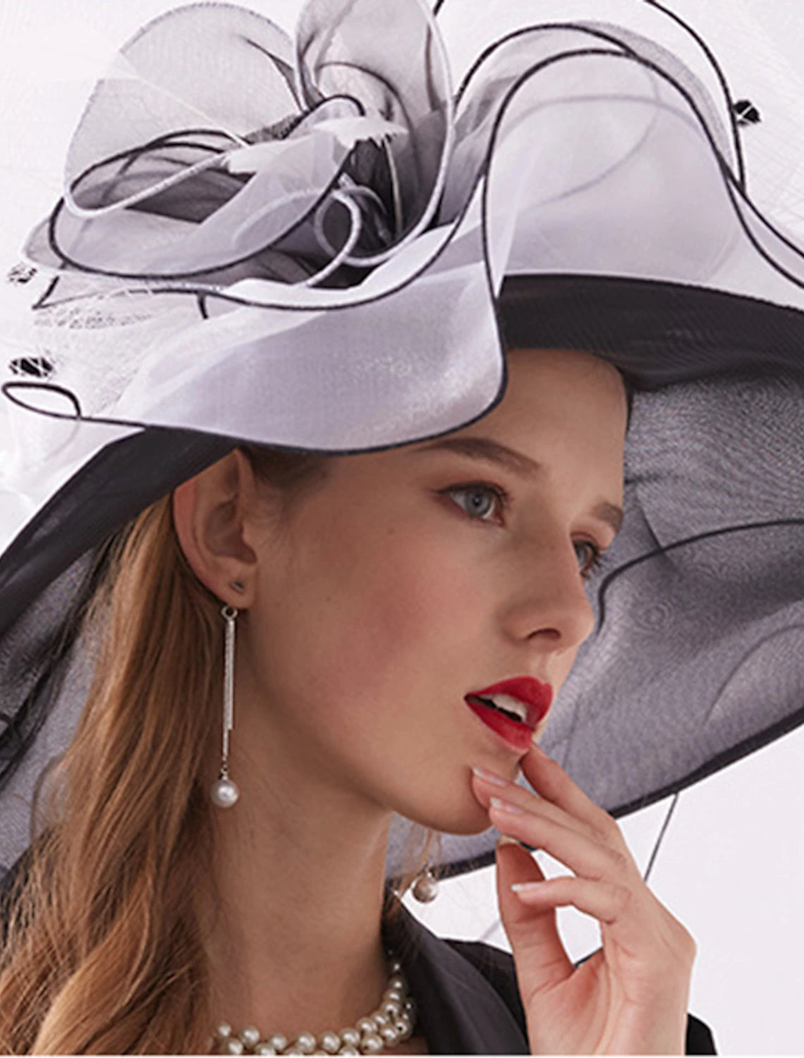 Close-up of the organza wide brim derby hat, showing fabric detail.