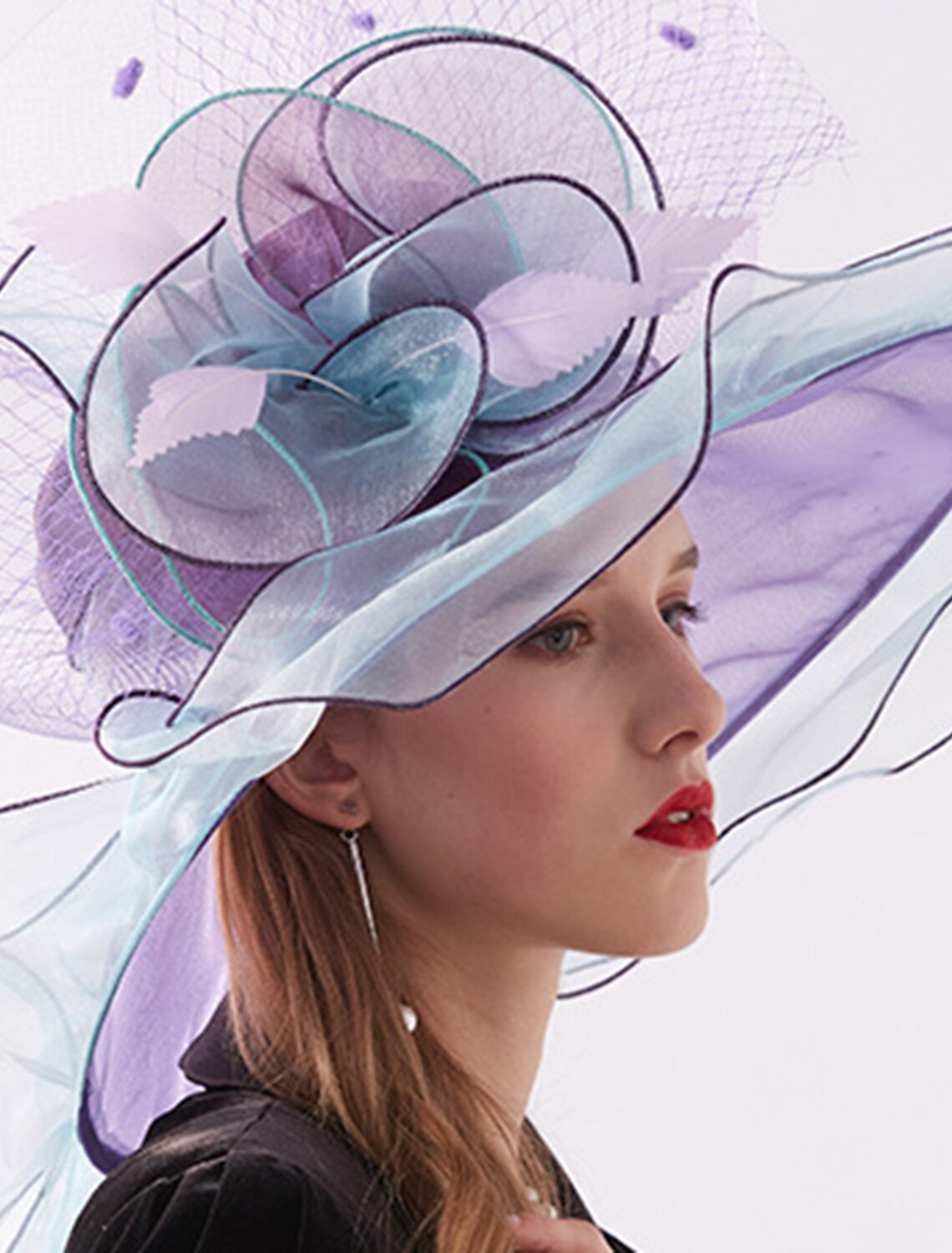 Side view of a woman wearing the stylish organza tea party hat.