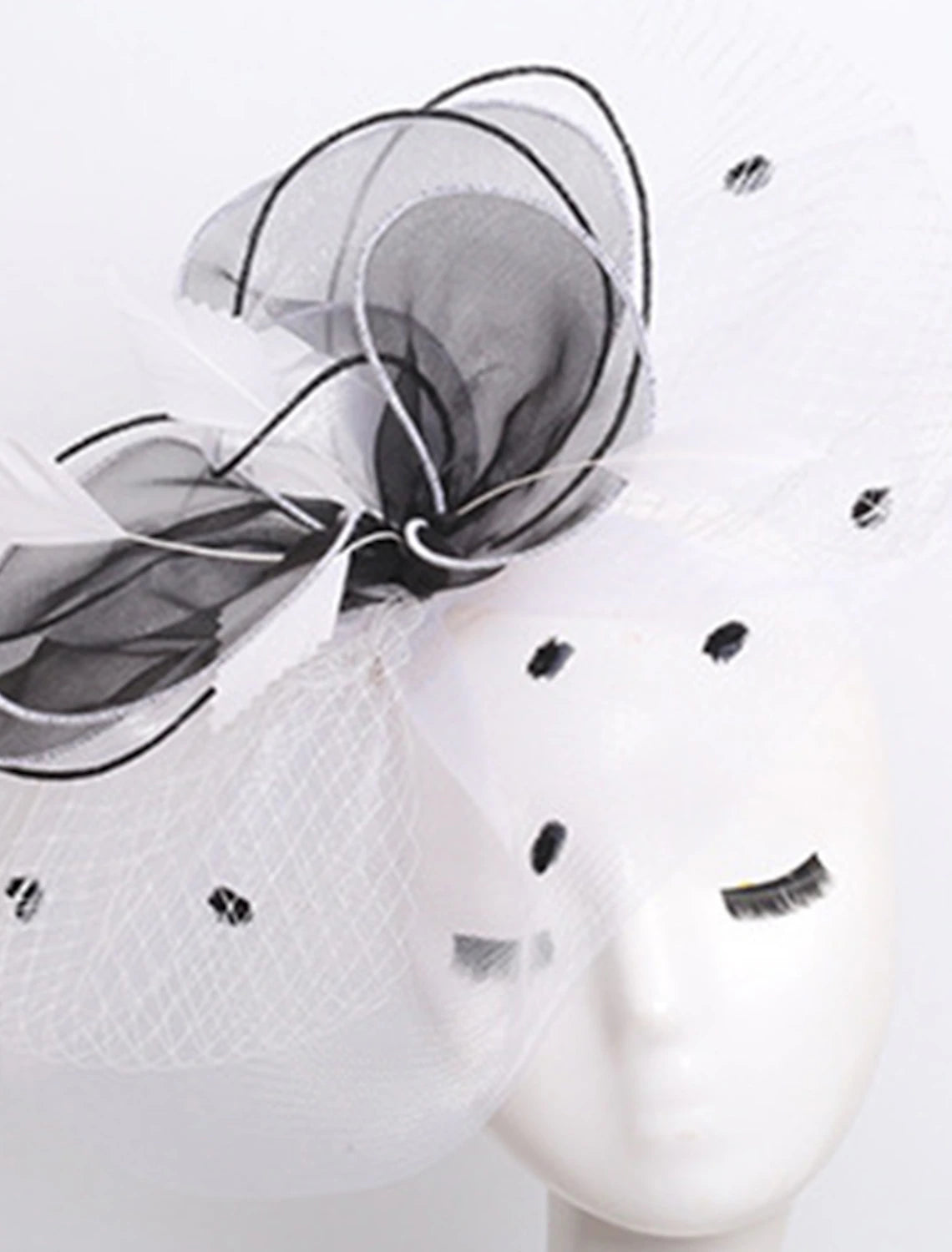 Organza wide brim hat displayed on a mannequin.