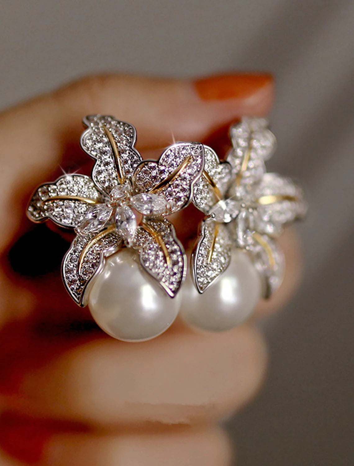 Elegant gold and white petal stud earring.