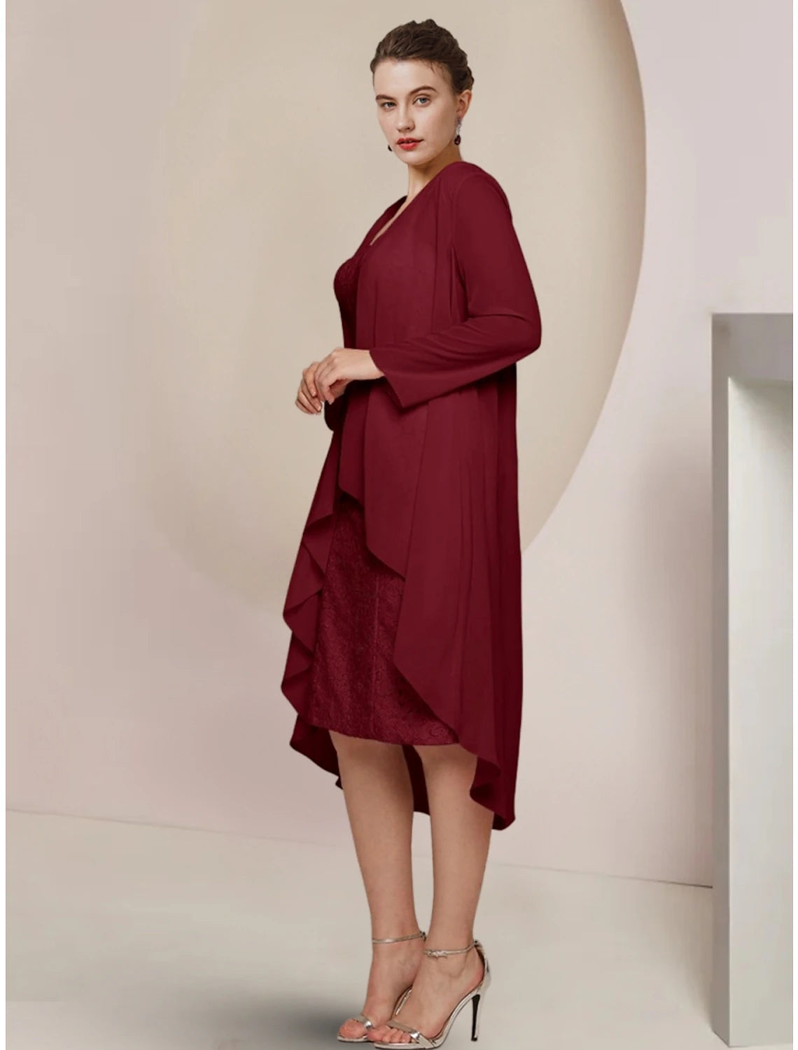 Close-up of the square neckline and long sleeve detail on a petite dress.