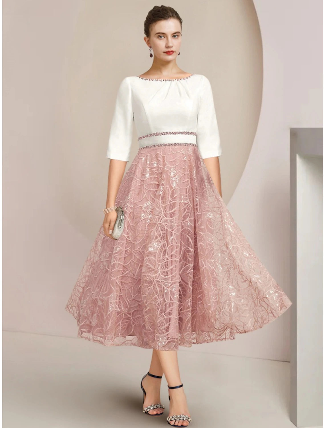 Elegant petite A-line mother of the bride dress with scoop neck, half sleeves, tea length, chiffon lace, and sequin ruching.