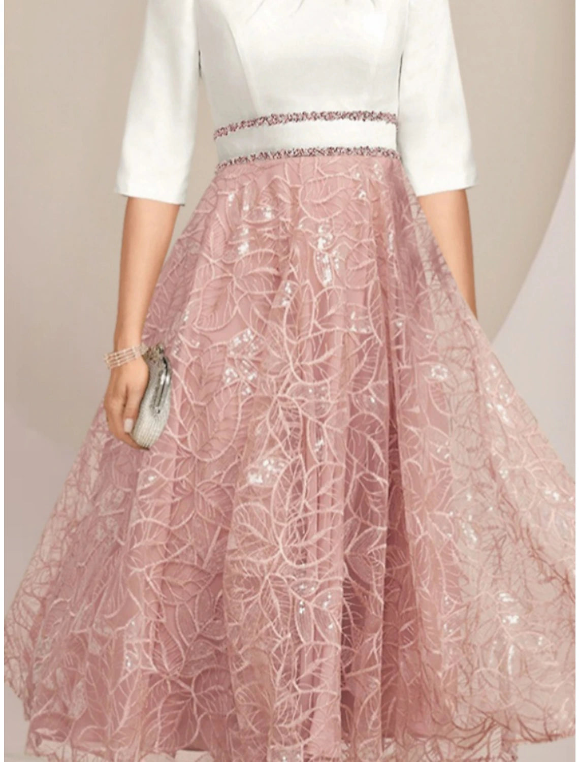 Back view of the elegant petite A-line mother of the bride dress with scoop neck and tea length.