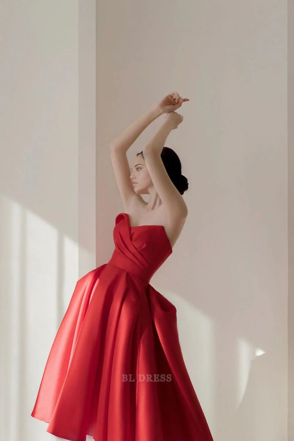 Elegant red A-line strapless pleated dress, front view.