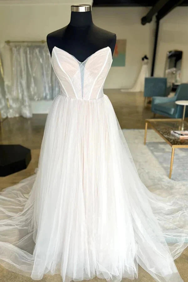 Elegant A-line wedding dress with pleated tulle and sweetheart neckline.