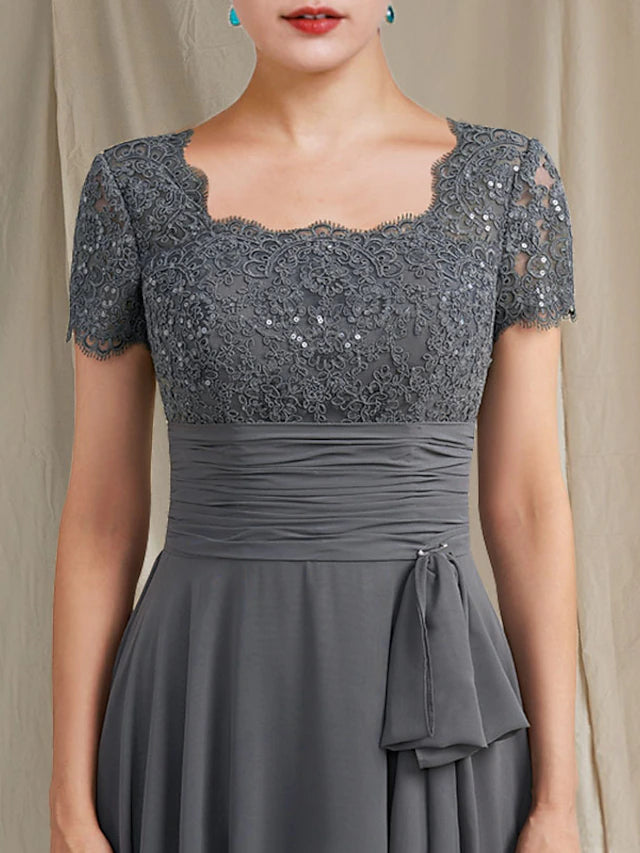 Close-up of chiffon and lace fabric with sequin appliques on the A-Line gown.