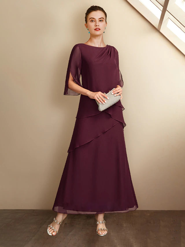 Elegant plus size A-line Mother of the Bride dress in chiffon with jewel neck and half sleeves.