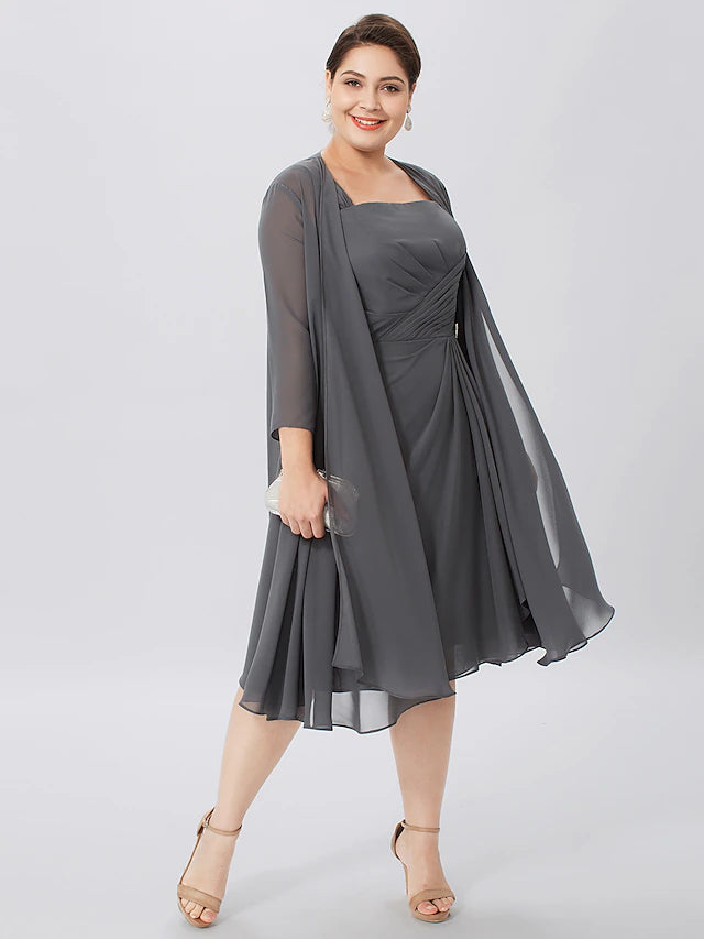 Plus size formal knee-length dress with criss cross pleats.