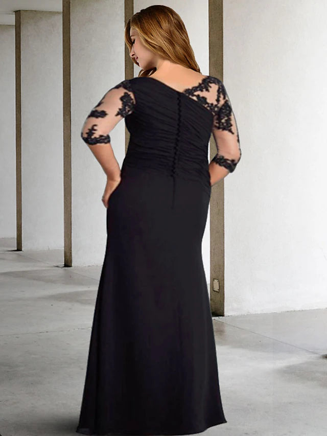 Formal floor-length dress with jewel neck, half sleeves, pleats, and appliques.