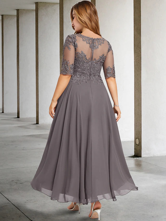 Close-up of the delicate beading appliques and jewel neckline on the chiffon dress.
