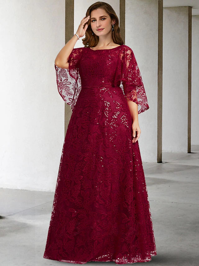 Elegant plus size A-line Mother of the Bride dress with jewel neck, half sleeves, lace, and sequin appliques.