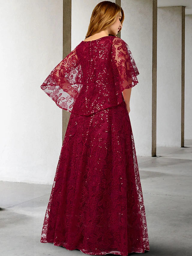 Back view of the floor-length A-line Mother of the Bride dress, showcasing its elegant silhouette and drape.