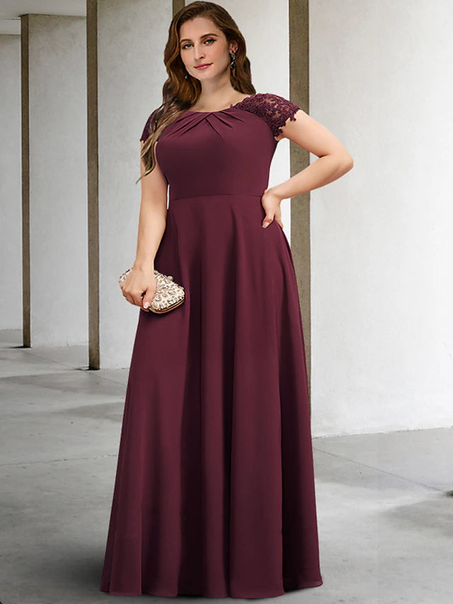 Elegant A-line plus size mother of the bride gown with short sleeves and jewel neck.