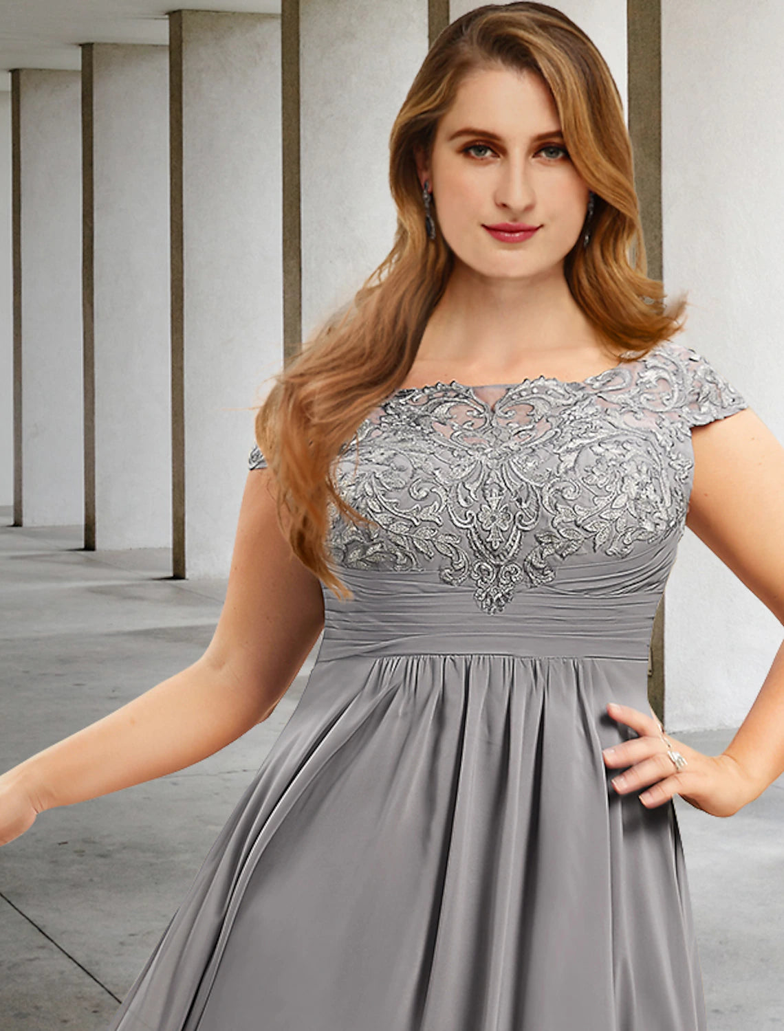 Back view of plus size tea length formal dress with delicate pleats.