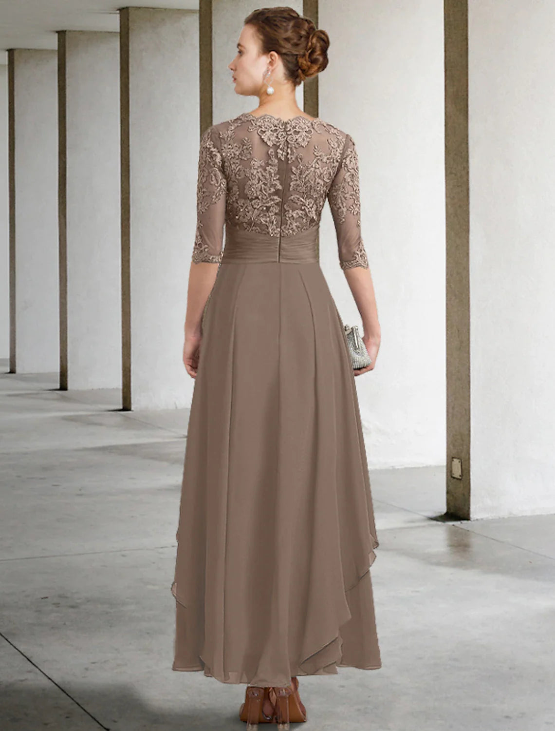 Back view of the A-line chiffon lace dress with ruched details.