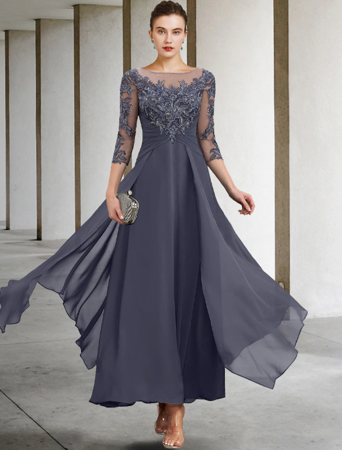 Close-up of the scoop neck and 3/4 sleeves with appliques on the dress.