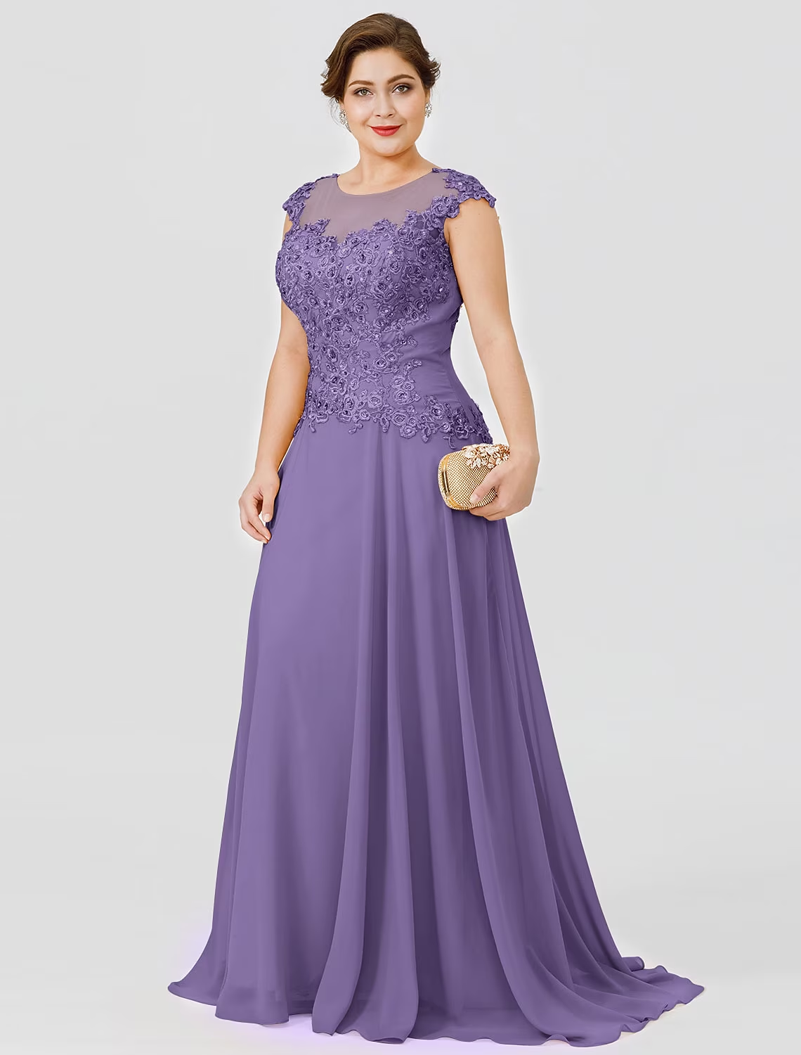 Plus size formal gown featuring beaded lace details and a sweep train.