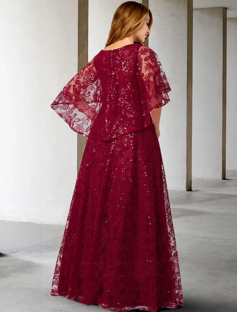 Floor-length A-line gown featuring lace and sequin appliques.
