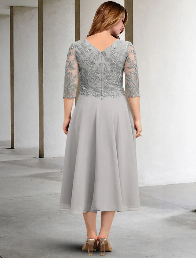 Plus size chiffon formal dress with sequin applique detail, side view.