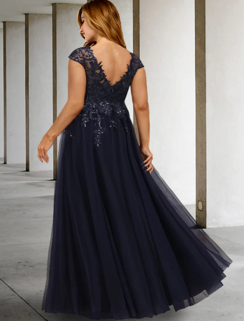 Side view of an elegant plus size A-line formal dress, showcasing sequin details on tulle fabric.