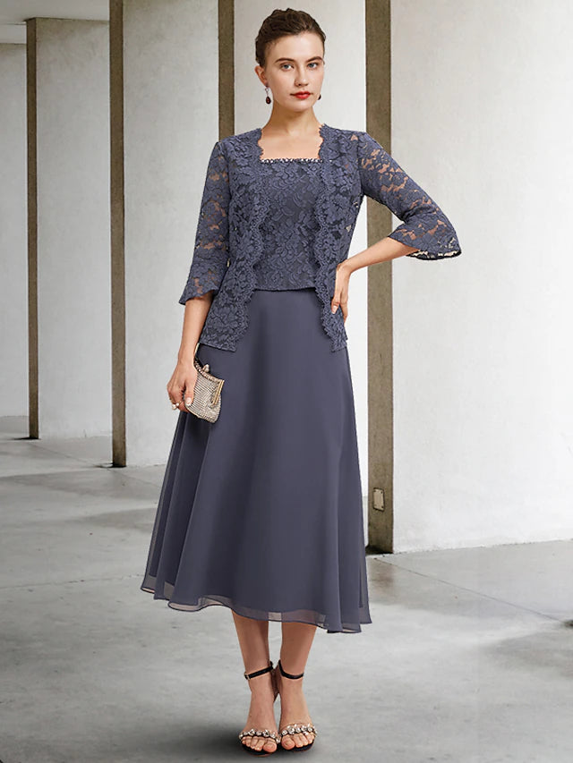 Plus size woman wearing an elegant A-line tea length Mother of the Bride dress with a square neck and matching jacket.