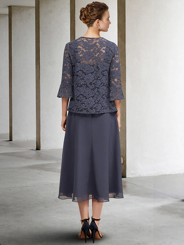 Close-up of the square neckline and delicate lace details on the plus size Mother of the Bride dress.