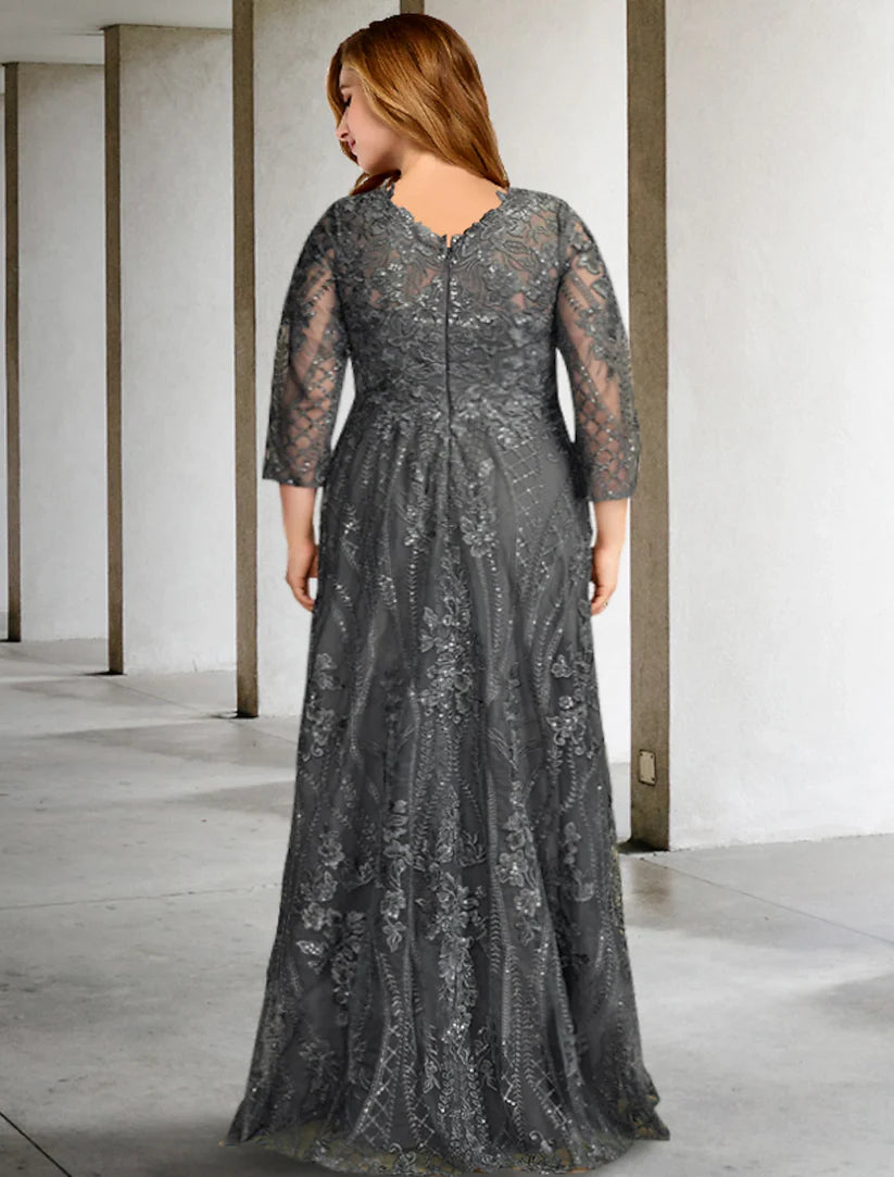 Back view of a woman wearing a formal plus size A-line chiffon gown with a sweep train.