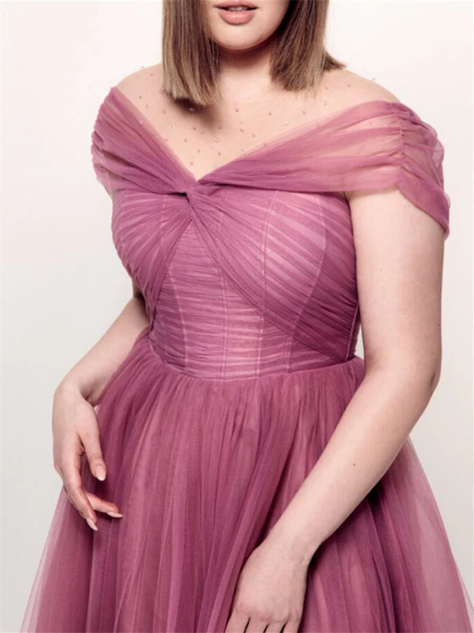 Model showcasing a plus size off-the-shoulder A-line knee-length dress, three-quarter view.