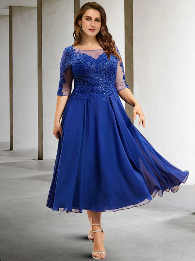 Elegant A-line plus size Mother of the Bride dress in chiffon with jewel neck and half sleeves.