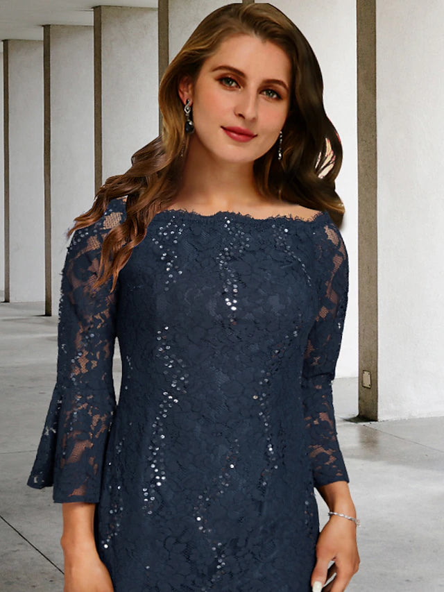 Side view of the tea length A-line dress, showcasing lace and sequin appliques.