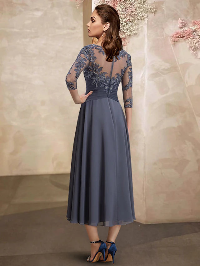 Plus size A-line tea length dress with jewel neck and short sleeves.