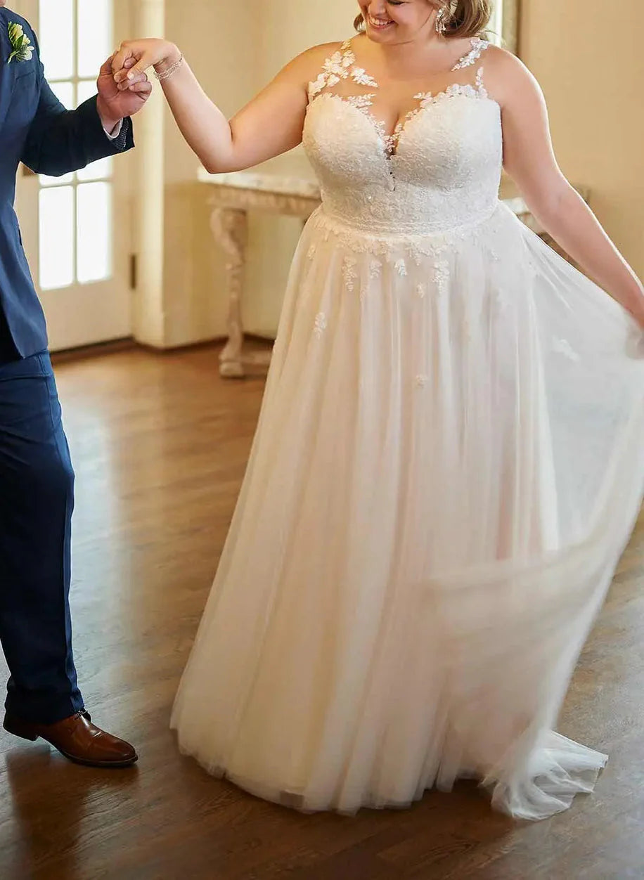 Back view of the plus size A-line wedding dress, showcasing its elegant silhouette.