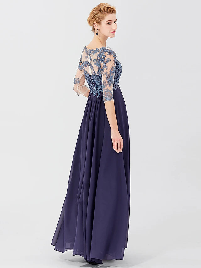 Close-up of the V-neckline and sheer lace 3/4 sleeves of the formal gown.