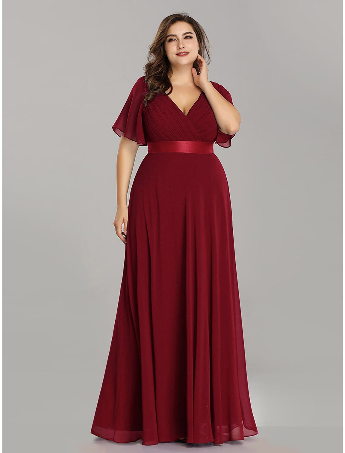 Elegant A-line V-neck chiffon Mother of the Bride dress with short sleeves and sash.