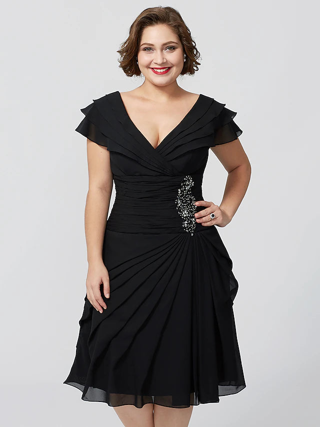Back view of a plus size A-line mother of the bride dress with tiered skirt.