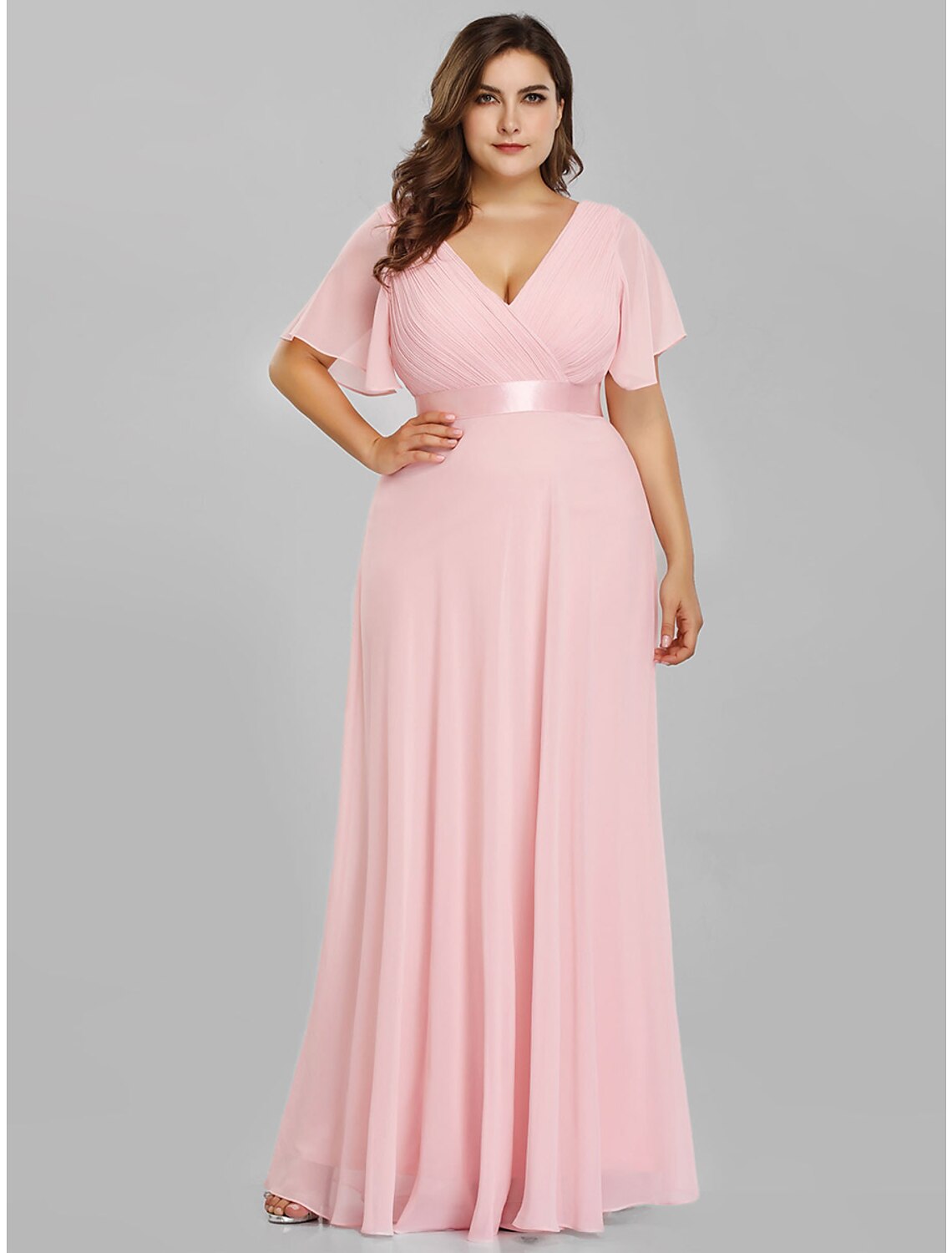 Close-up of the V-neckline and short sleeve on the chiffon dress.