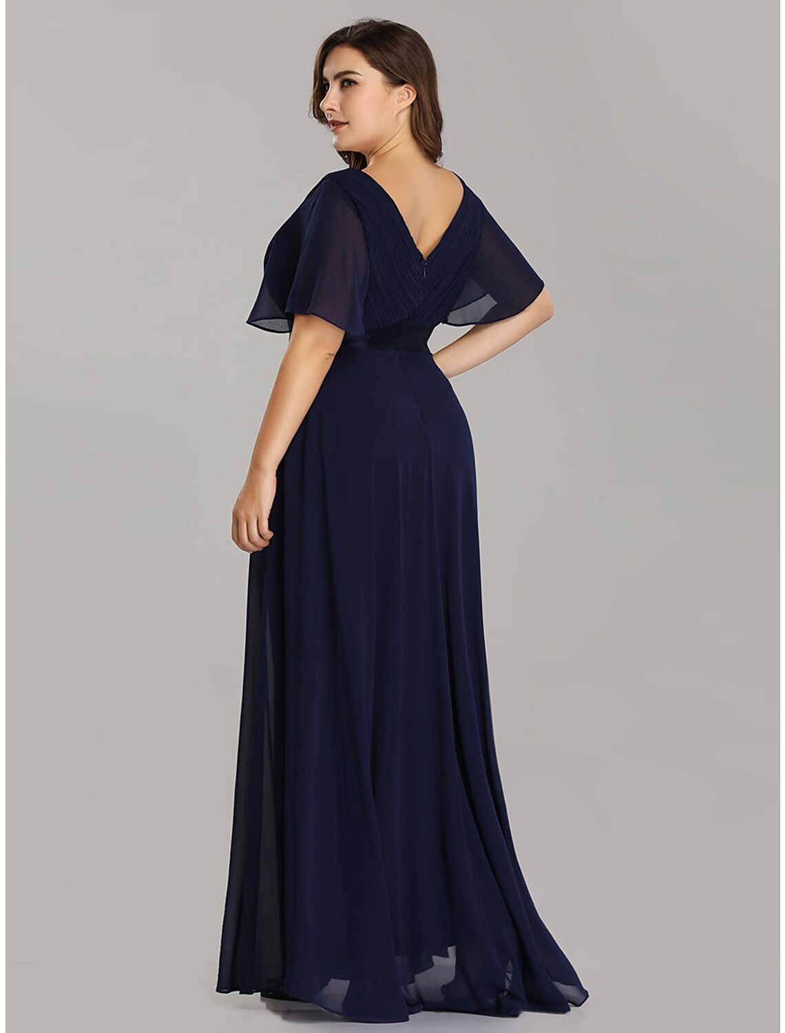Chiffon fabric detail and flow of the floor-length formal dress.