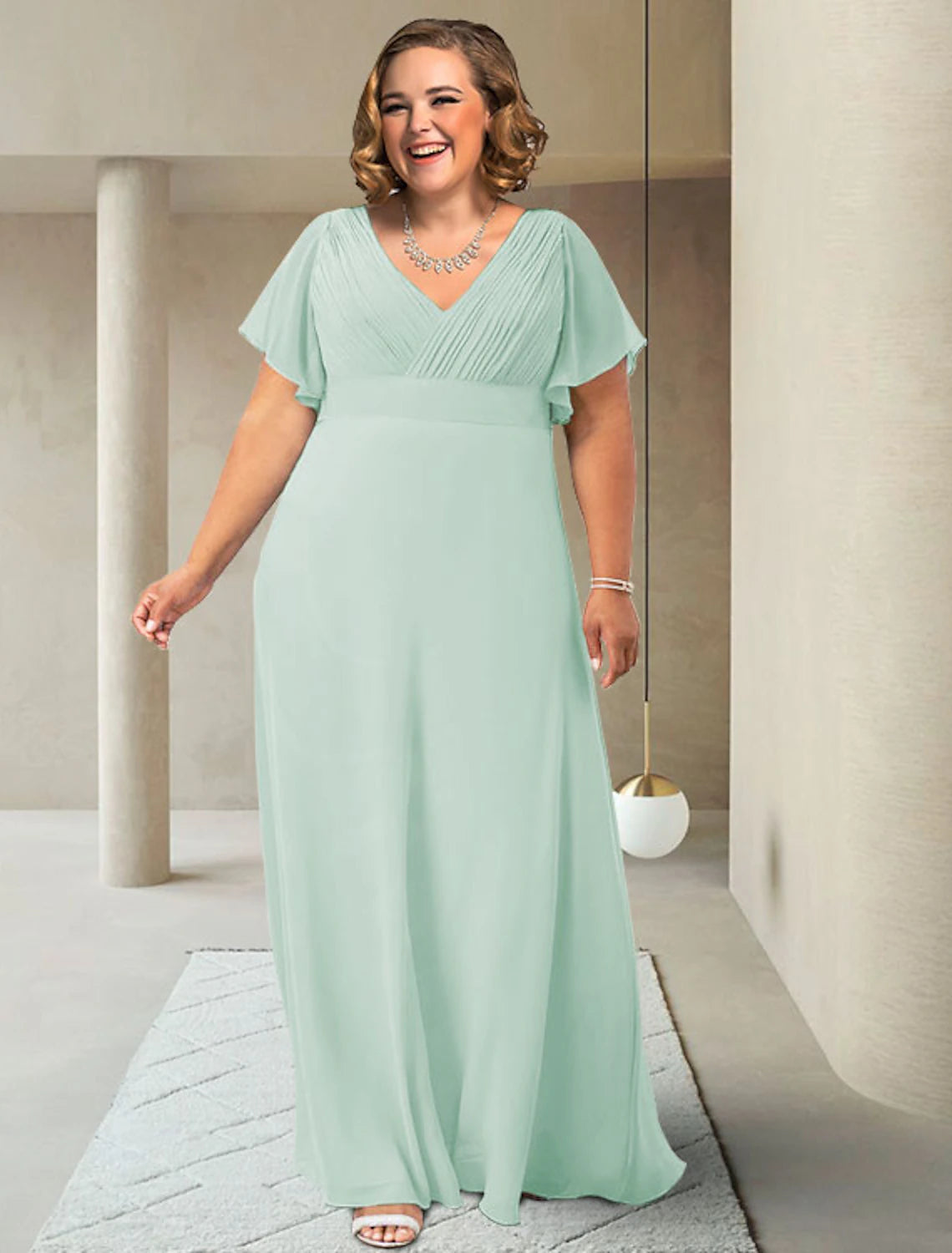 Plus size A-line Mother of the Bride dress with V-neck and short sleeves.