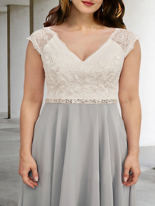 Elegant plus size chiffon gown with crystal appliques.