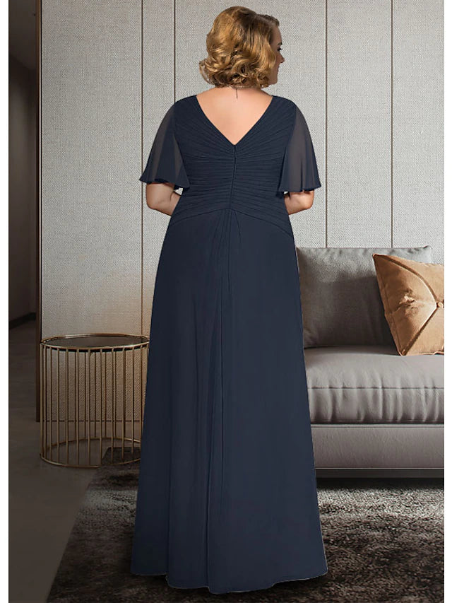 Plus size Mother of the Bride gown with ruched bodice and ankle length skirt.