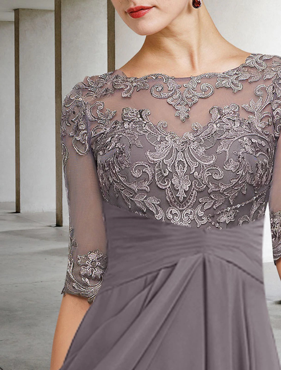 Close-up of the chiffon and lace fabric with delicate beading appliques.